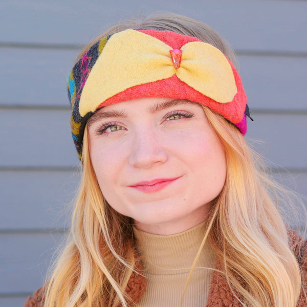 woman smiling wearing bright upcycled wool headband