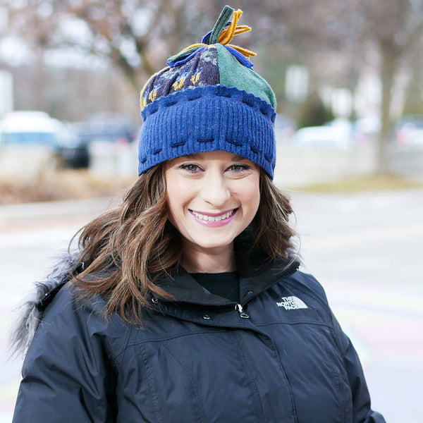 woman smiling wearing upcycled wool ski hat